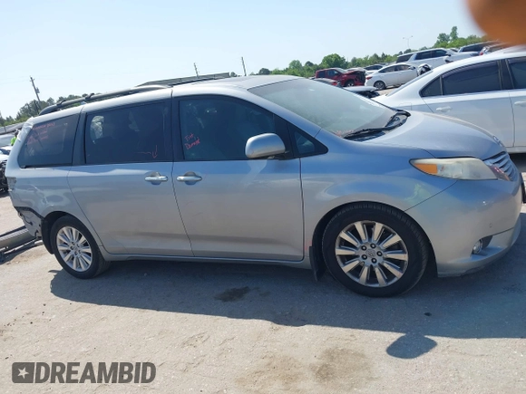 2012 Toyota Sienna XLE AAS with VIN 5TDYK3DC7CS185555, listed as a IAAI auction lot 42013098 with 140,969 mi miles. Bid and sale history available at carsss.com. Image 14.