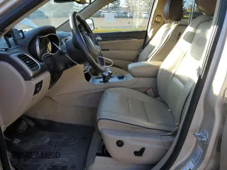 2015 Jeep Grand Cherokee High Altitude with VIN 1C4RJFCM6FC878769, listed as a Copart auction lot 46704755 with 81,727 mi miles and Salvage title. Bid and sale history available at DreamBid. Image 7.