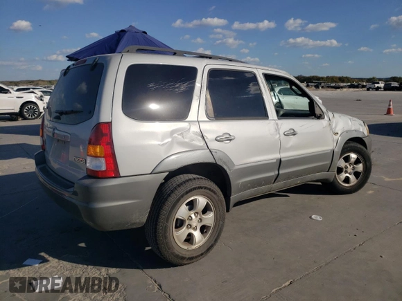 2002 Mazda Tribute LX with VIN 4F2YU09182KM64860, listed as a Copart auction lot 77391824 with 207,965 mi miles and Salvage Title. Bid and sale history available at DreamBid. Image 3.