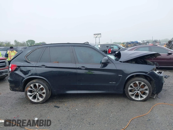 2015 BMW X5 xDrive50i z VIN 5UXKR6C56F0J78575, wystawiony jako IAAI lot #41933018 z przebiegiem Nie podano mil oraz . Historia ofert i sprzedaży dostępna na DreamBid. Obrazek 14.