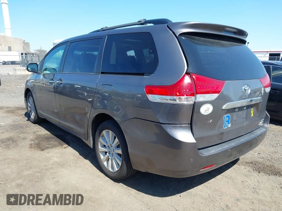 2013 Toyota Sienna XLE with VIN 5TDDK3DC0DS059036, listed as a IAAI auction lot 42069896 with 124,105 mi miles and . Bid and sale history available at DreamBid. Image 3.