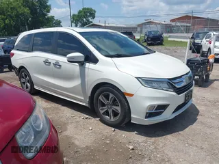 2018 Honda Odyssey Touring with VIN 5FNRL6H84JB035980, listed as a IAAI auction lot 42634118 with 146,271 mi miles and . Bid and sale history available at DreamBid. Image 1.