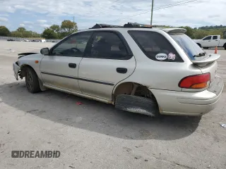 1999 Subaru Impreza L with VIN JF1GF4351XH815210, listed as a Copart auction lot 71250504 with 141,806 mi miles and Salvage title. Bid and sale history available at DreamBid. Image 2.