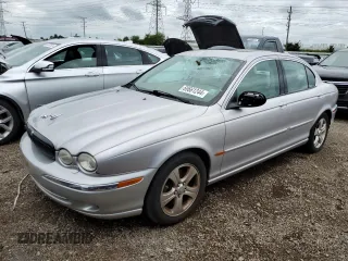 2002 Jaguar X-Type with VIN SAJEA51C02WC20249, listed as a Copart auction lot 69661244 with 97,184 mi miles and Clean Title. Bid and sale history available at carsss.com. Image 1.