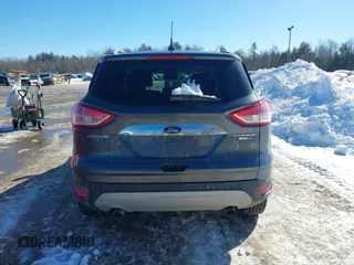 2015 Ford Escape Titanium with VIN 1FMCU9JX6FUB86304, listed as a IAAI auction lot 41595761 with 104,317 mi miles and . Bid and sale history available at DreamBid. Image 16.