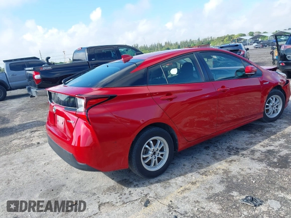 2021 Toyota Prius L Eco with VIN JTDKAMFU4M3145215, listed as a IAAI auction lot 41926274 with 74,220 mi miles. Bid and sale history available at carsss.com. Image 4.