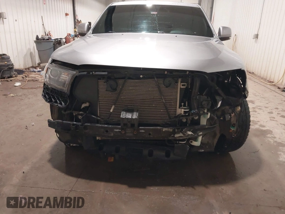 2014 Dodge Durango R/T with VIN 1C4SDJCTXEC558937, listed as a IAAI auction lot 41570244 with 174,724 mi miles and . Bid and sale history available at DreamBid. Image 6.