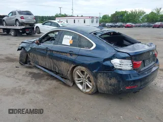 2016 BMW 4 Series 428i with VIN WBA4A9C52GGL88003, listed as a IAAI auction lot 42225642 with 105,054 mi miles and . Bid and sale history available at DreamBid. Image 3.
