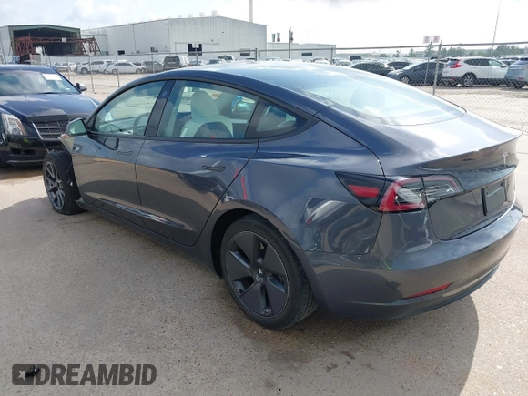 2023 Tesla Model 3 with VIN 5YJ3E1EA7PF567906, listed as a IAAI auction lot 42280993 with 41,452 mi miles and . Bid and sale history available at DreamBid. Image 3.