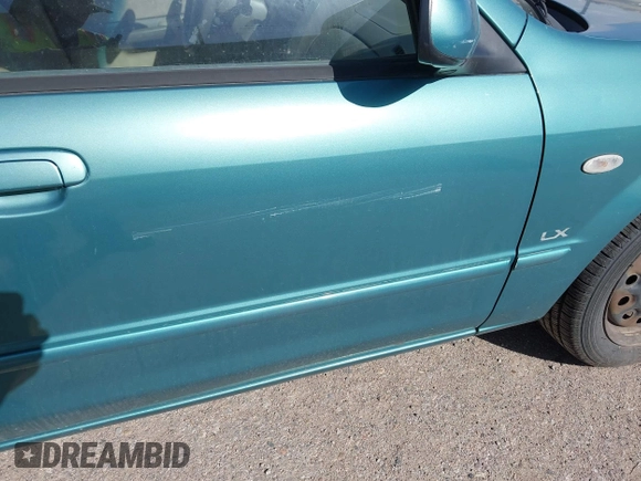 2002 Mazda Protege DX z VIN JM1BJ225021606891, wystawiony jako IAAI lot #42011997 z przebiegiem 134 758 mil mil oraz . Historia ofert i sprzedaży dostępna na DreamBid. Obrazek 6.