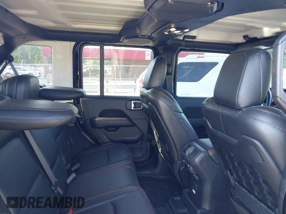 2022 Jeep Wrangler Unlimited Rubicon with VIN 1C4HJXFNXNW149063, listed as a IAAI auction lot 42130171 with 33,961 mi miles and . Bid and sale history available at DreamBid. Image 8.