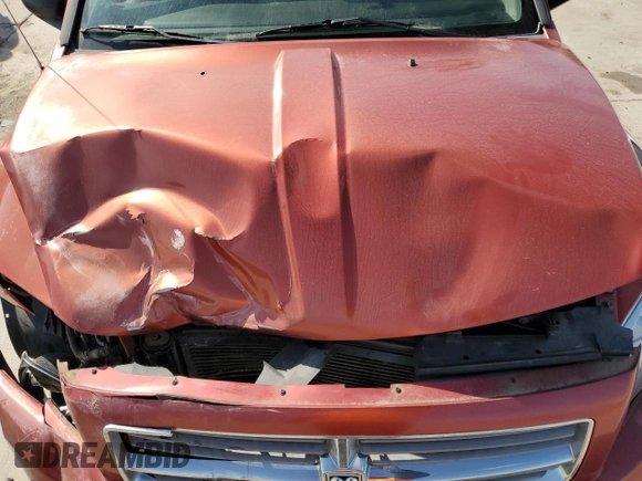 2010 Dodge Caliber Mainstreet z VIN 1B3CB3HA0AD641764, wystawiony jako Copart lot #52440225 z przebiegiem 125 123 mil mil oraz Szkoda całkowita • Salvage title. Historia ofert i sprzedaży dostępna na DreamBid. Obrazek 11.