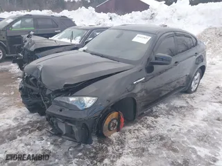 2011 BMW X6 M with VIN 5YMGZ0C57BLK14388, listed as a IAAI auction lot 41411854 with 129,248 mi miles. Bid and sale history available at carsss.com. Image 2.