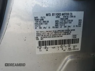 2013 Ford Edge SE with VIN 2FMDK3GC4DBC06788, listed as a Copart auction lot 61033945 with 198,395 mi miles and Salvage title. Bid and sale history available at DreamBid. Image 13.