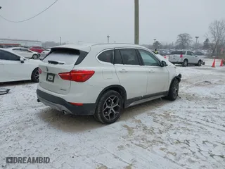 2018 BMW X1 xDrive28i with VIN WBXHT3C33J3H29973, listed as a IAAI auction lot 41547866 with 1 mi miles. Bid and sale history available at carsss.com. Image 4.