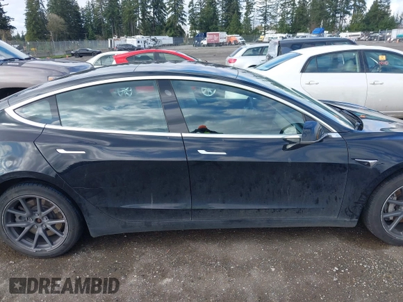 2019 Tesla Model 3 Mid Range with VIN 5YJ3E1EA4KF305611, listed as a IAAI auction lot 41916738 with 59,101 mi miles and . Bid and sale history available at carsss.com. Image 13.