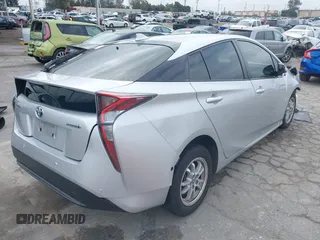 2018 Toyota Prius Two with VIN JTDKARFU0J3056217, listed as a IAAI auction lot 42185122 with 52,344 mi miles and . Bid and sale history available at DreamBid. Image 4.