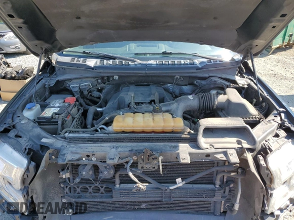 2015 Ford F-150 XLT with VIN 1FTEW1EP7FKE12574, listed as a Copart auction lot 59519985 with 133,337 mi miles and Salvage title. Bid and sale history available at DreamBid. Image 11.