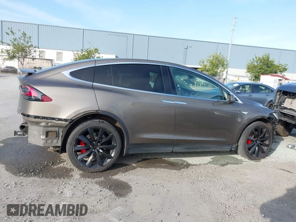 2016 Tesla Model X P90D with VIN 5YJXCAE45GF000773, listed as a IAAI auction lot 42052642 with 127,670 mi miles. Bid and sale history available at carsss.com. Image 14.
