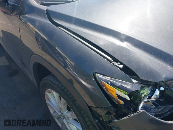 2014 Mazda CX-5 Grand Touring with VIN JM3KE4DY8E0391317, listed as a IAAI auction lot 41871641 with 77,048 mi miles. Bid and sale history available at carsss.com. Image 18.