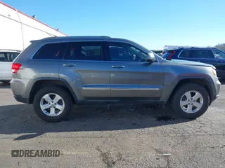 2011 Jeep Grand Cherokee Laredo with VIN 1J4RR4GG9BC714325, listed as a IAAI auction lot 41560915 with 153,372 mi miles and . Bid and sale history available at DreamBid. Image 13.