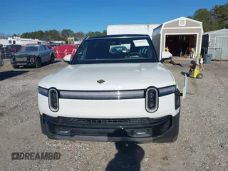 2025 Rivian R1S Adventure with VIN 7PDSGBBA0SN049154, listed as a IAAI auction lot 41160166 with 3,036 mi miles. Bid and sale history available at carsss.com. Image 12.