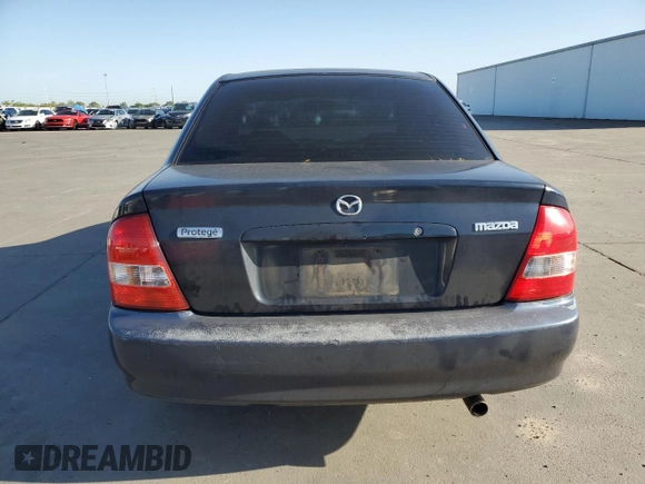 1999 Mazda Protege DX z VIN JM1BJ2227X0106522, wystawiony jako Copart lot #52423565 z przebiegiem 206 260 mil mil oraz Szkoda całkowita • Salvage title. Historia ofert i sprzedaży dostępna na DreamBid. Obrazek 6.