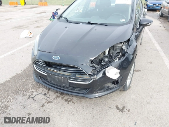 2015 Ford Fiesta SE z VIN 3FADP4EJ3FM115466, wystawiony jako IAAI lot #41849165 z przebiegiem 178 002 mil mil oraz . Historia ofert i sprzedaży dostępna na DreamBid. Obrazek 6.