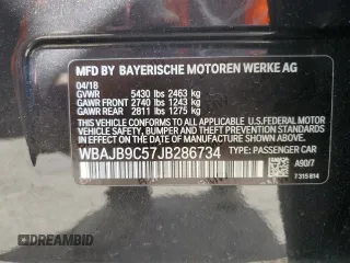 2018 BMW 5 Series M550i xDrive with VIN WBAJB9C57JB286734, listed as a Copart auction lot 52711235 with 127,450 mi miles and Salvage title. Bid and sale history available at DreamBid. Image 12.