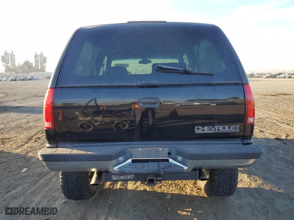 1998 Chevrolet Tahoe with VIN 3GNEK18R6WG102052, listed as a Copart auction lot 77485244 with 187,542 mi miles and Salvage Title. Bid and sale history available at carsss.com. Image 6.