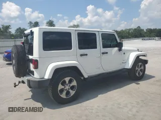 2016 Jeep Wrangler Unlimited Sahara with VIN 1C4BJWEG6GL182794, listed as a Copart auction lot 57880725 with 127,752 mi miles and Salvage title. Bid and sale history available at DreamBid. Image 3.