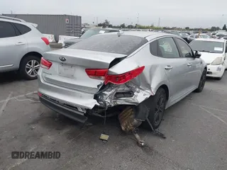 2018 Kia Optima S with VIN 5XXGT4L35JG216039, listed as a IAAI auction lot 42451216 with 91,679 mi miles and . Bid and sale history available at DreamBid. Image 4.