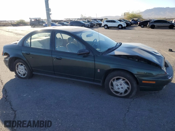 1996 Saturn SL with VIN 1G8ZK5272TZ137198, listed as a Copart auction lot 72446614 with 99,586 mi miles and Salvage title. Bid and sale history available at DreamBid. Image 4.