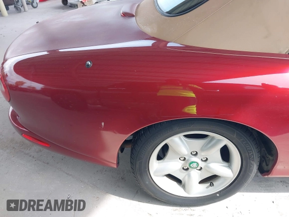 1997 Jaguar XK with VIN SAJGX274XVC004952, listed as a IAAI auction lot 42211023 with 109,889 mi miles and . Bid and sale history available at DreamBid. Image 13.