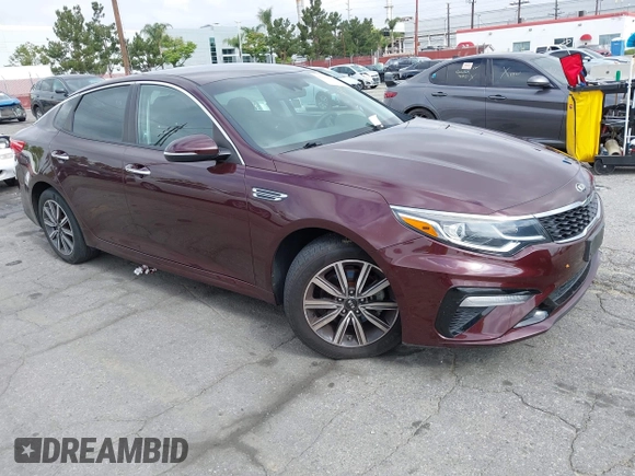 2019 Kia Optima LX z VIN 5XXGT4L37KG354649, wystawiony jako IAAI lot #42130410 z przebiegiem 61 315 mil mil oraz . Historia ofert i sprzedaży dostępna na DreamBid. Obrazek 1.