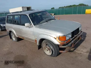 1991 Toyota Land Cruiser z VIN JT3FJ80W5M0014142, wystawiony jako IAAI lot #42496939 z przebiegiem 181 150 mil mil oraz . Historia ofert i sprzedaży dostępna na DreamBid. Obrazek 1.
