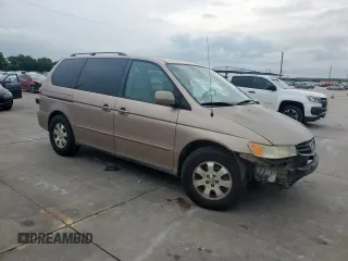 2004 Honda Odyssey EX-L with VIN 5FNRL18944B107051, listed as a Copart auction lot 58542335 with 207,951 mi miles and Salvage title. Bid and sale history available at DreamBid. Image 4.