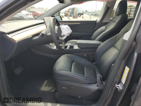 2023 Tesla Model Y Long Range with VIN 7SAYGDEE9PF885405, listed as a Copart auction lot 52858105 with 23,424 mi miles and Non Repairable. Bid and sale history available at DreamBid. Image 7.