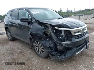 2020 Honda Pilot EX-L with VIN 5FNYF6H57LB059332, listed as a IAAI auction lot 42614422 with 110,279 mi miles and . Bid and sale history available at DreamBid. Image 1.