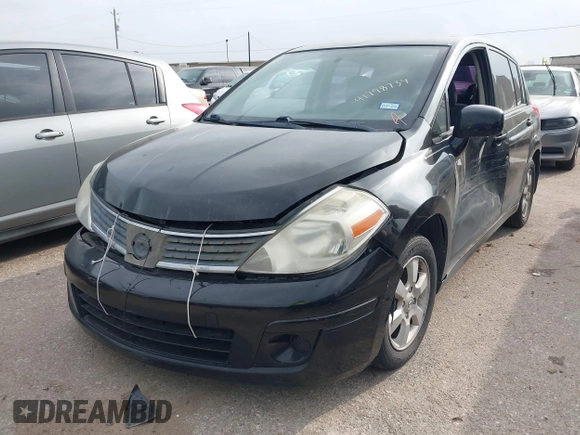 2009 Nissan Versa 1.8 SL with VIN 3N1BC13E59L496882, listed as a IAAI auction lot 41798734 with 210,907 mi miles. Bid and sale history available at carsss.com. Image 2.