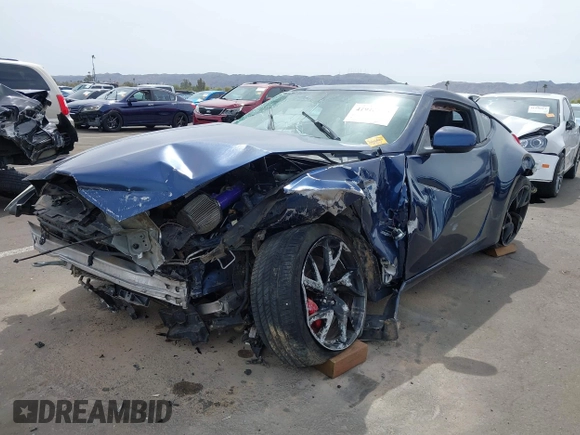 2013 Nissan 370Z z VIN JN1AZ4EH2DM380511, wystawiony jako IAAI lot #41912193 z przebiegiem Nie podano mil oraz . Historia ofert i sprzedaży dostępna na DreamBid. Obrazek 2.