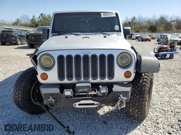2010 Jeep Wrangler Unlimited Rubicon with VIN 1J4BA6H12AL107485, listed as a Copart auction lot 48802825 with 123,299 mi miles and Salvage title. Bid and sale history available at DreamBid. Image 5.