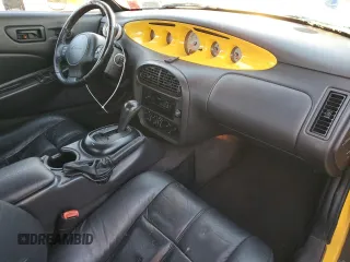 1999 Plymouth Prowler z VIN 1P3EW65G0XV501156, wystawiony jako Copart lot #85935754 z przebiegiem 35 947 mil mil oraz Szkody całkowita. Historia ofert i sprzedaży dostępna na DreamBid. Obrazek 8.