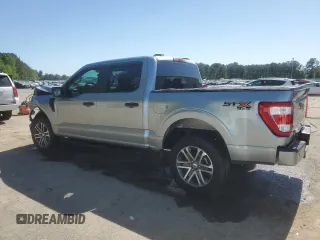 2023 Ford F-150 XL with VIN 1FTFW1E55PKF18784, listed as a Copart auction lot 52807315 with 15,284 mi miles and Salvage Title. Bid and sale history available at carsss.com. Image 2.