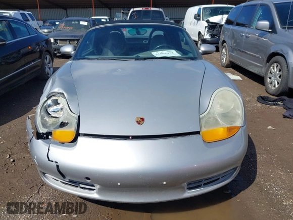 1999 Porsche Boxster z VIN WP0CA2989XU627152, wystawiony jako IAAI lot #41805432 z przebiegiem 112 380 mil mil oraz . Historia ofert i sprzedaży dostępna na DreamBid. Obrazek 12.