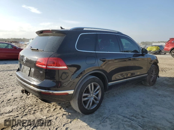 2016 Volkswagen Touareg Sport with VIN WVGEF9BP7GD010767, listed as a Copart auction lot 44782585 with 125,970 mi miles and Salvage Title. Bid and sale history available at DreamBid. Image 3.