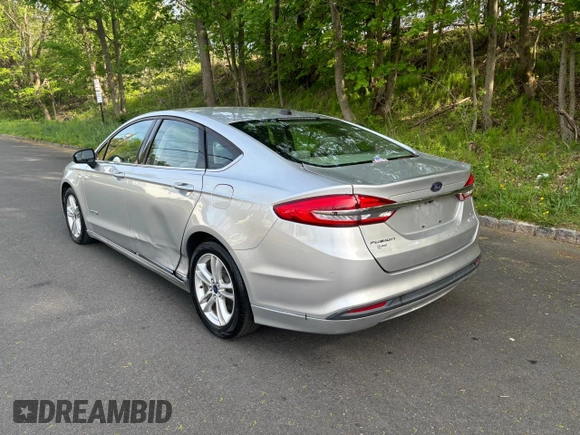 2018 Ford Fusion SE z VIN 3FA6P0LU9JR208728, wystawiony jako Copart lot #56345445 z przebiegiem 183 982 mil mil oraz Czysty tytuł • Clean title. Historia ofert i sprzedaży dostępna na DreamBid. Obrazek 3.