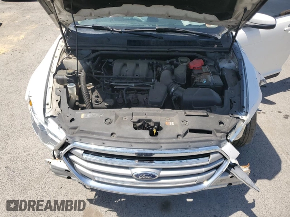 2015 Ford Taurus SEL z VIN 1FAHP2E82FG108442, wystawiony jako Copart lot #57790515 z przebiegiem 116 834 mil mil oraz Szkoda całkowita • Salvage title. Historia ofert i sprzedaży dostępna na DreamBid. Obrazek 11.