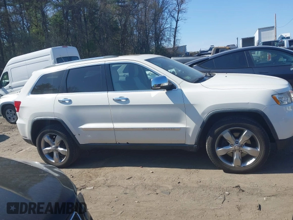 2011 Jeep Grand Cherokee Overland Summit with VIN 1J4RR6GT9BC546825, listed as a IAAI auction lot 42118789 with 123,449 mi miles. Bid and sale history available at carsss.com. Image 13.