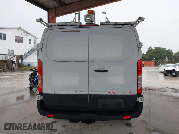 2015 Ford Transit Cargo z VIN 1FTNR1ZMXFKA45161, wystawiony jako IAAI lot #42181449 z przebiegiem 130 096 mil mil oraz . Historia ofert i sprzedaży dostępna na DreamBid. Obrazek 16.